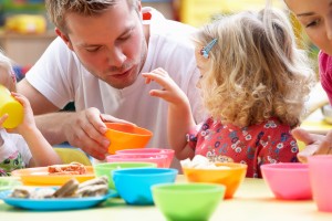 Man with children playing together