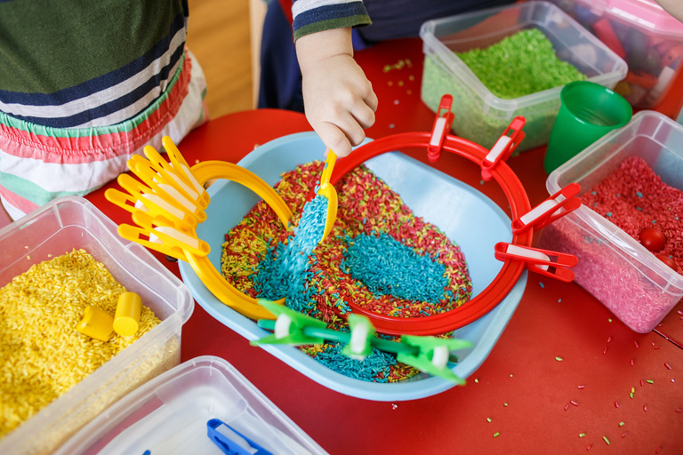Sensory Bin of Colored Rice for Sensory Activities